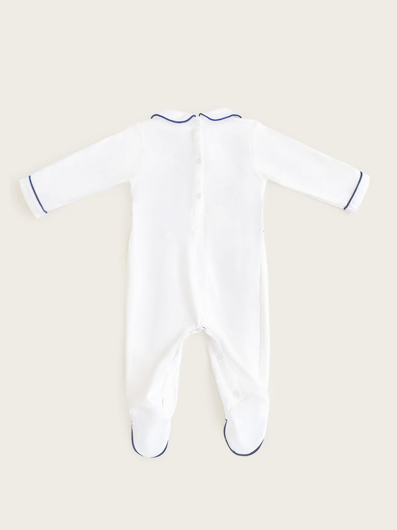 Little Collins Clothing white babygrow with smocking, peter pan collar and blue anchors back view of buttons