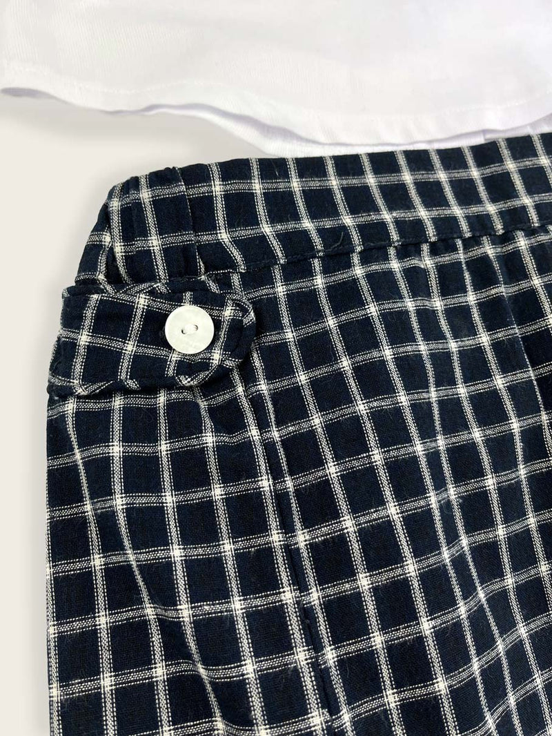 close up of French navy check skirt with side button detail